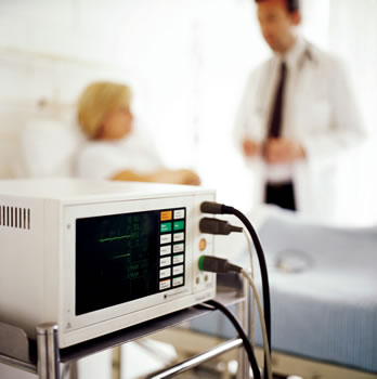 Hospital equipment with a doctor and nurse in the background
