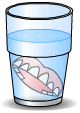 False teeth in a glass