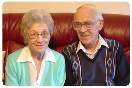 older man and woman sitting together
