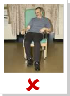 patient sitting awkwardly in chair and slumping to left side of it