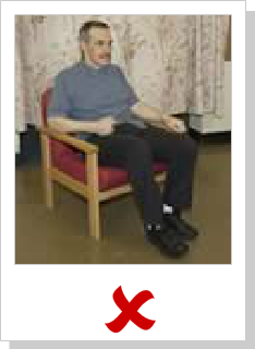 patient sitting in chair but not in ergonomically balanced position: his legs are too long